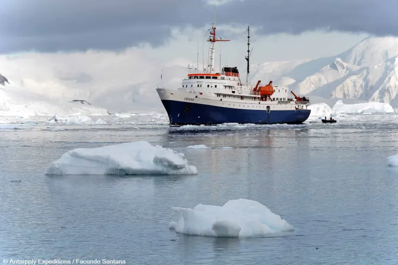 The expedition ship MV Ushuaia of Antarpply Expeditions among ice floes in Antarctica