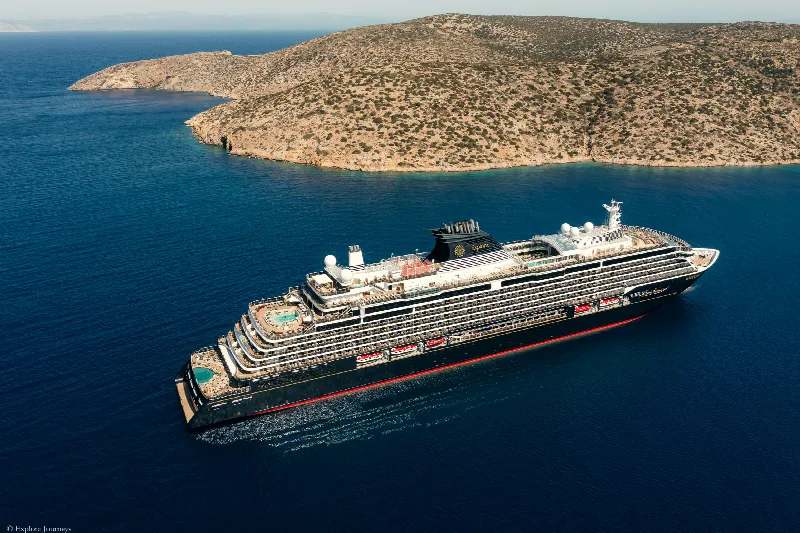 Explora I of Explora Journeys seen from above off an island coast