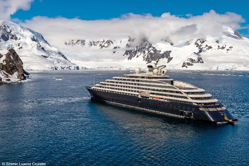 Scenic Eclipse below snow-covered mountains in Antarctica