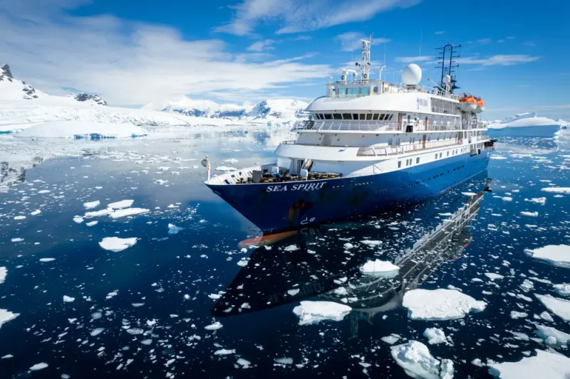 The expedition ship Sea Spirit of Poseidon Expeditions among ice floes in Antarctica